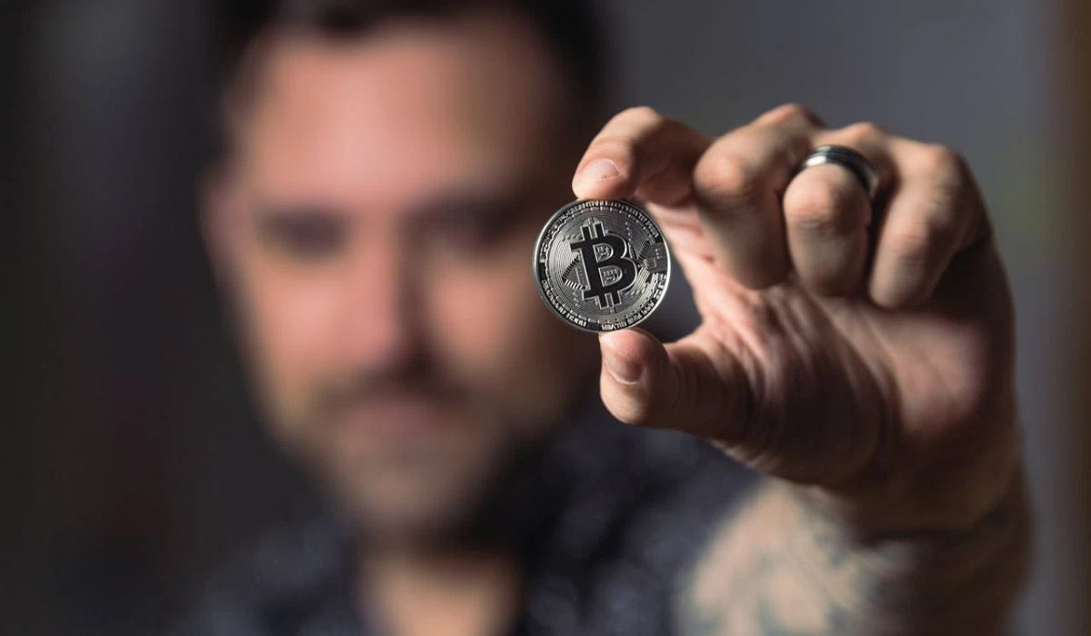 Trader Holding Bitcoin